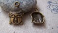 REF. CM00103 COLGANTE BUDA BRONCE MEDIDA 15 X 22 MM 0,50 EUROS / Unidad